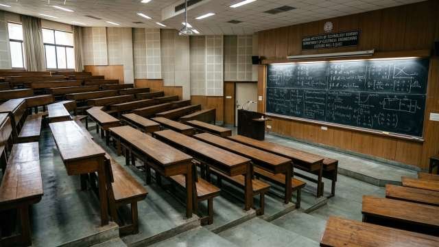 Empty lecture hall in premium institute representing faculty gaps